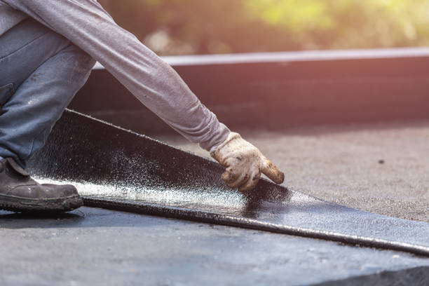 Professional Basement Waterproofing technician working in Fulton, MO
